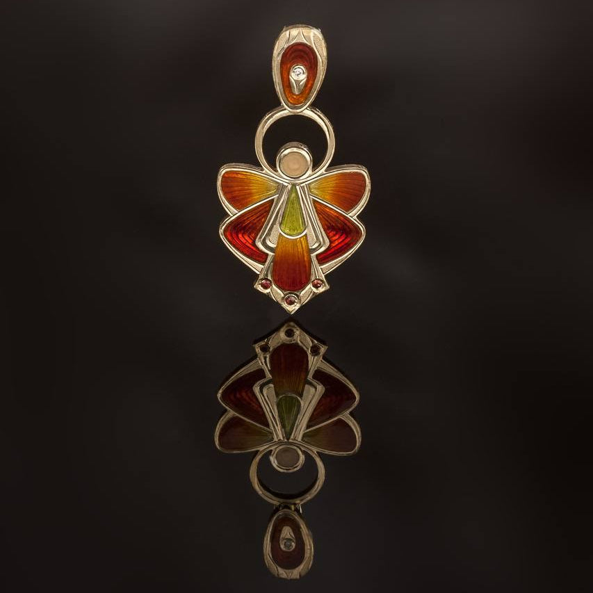 Decorative pendant with colorful design on a dark background
