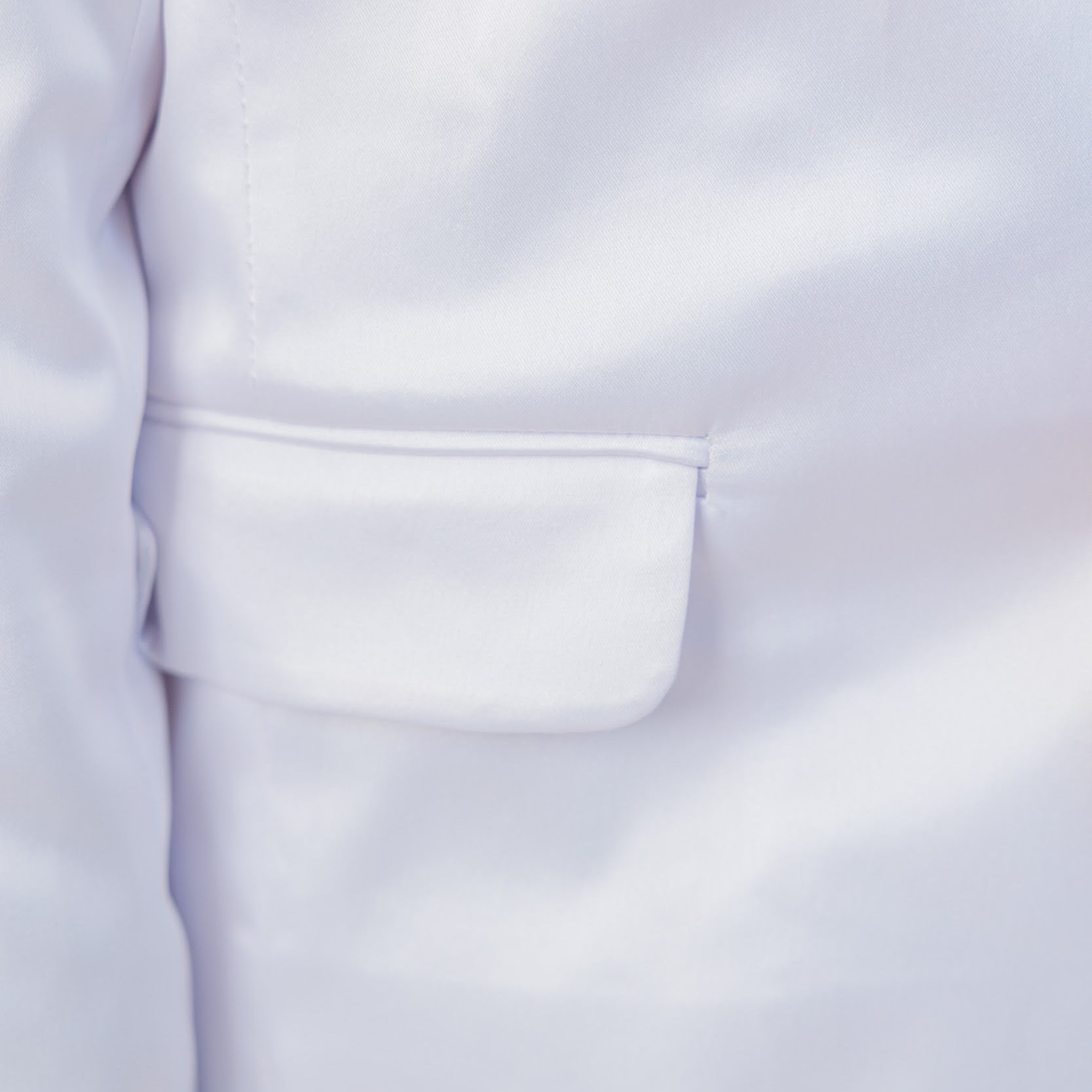 Close-up of a white lab coat with a pocket