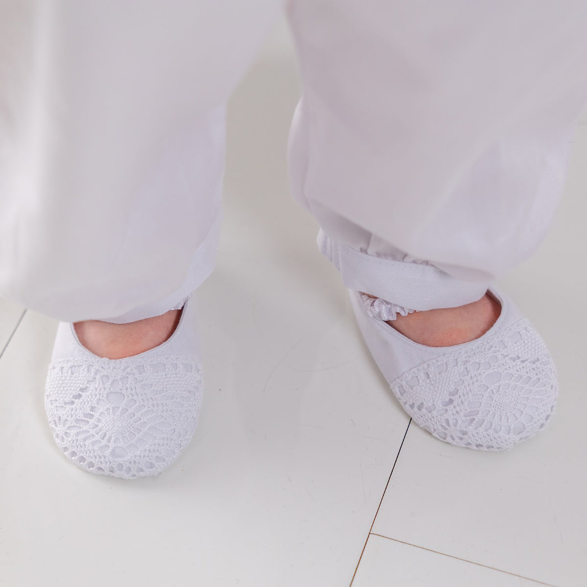 Christening Booties worn by a child