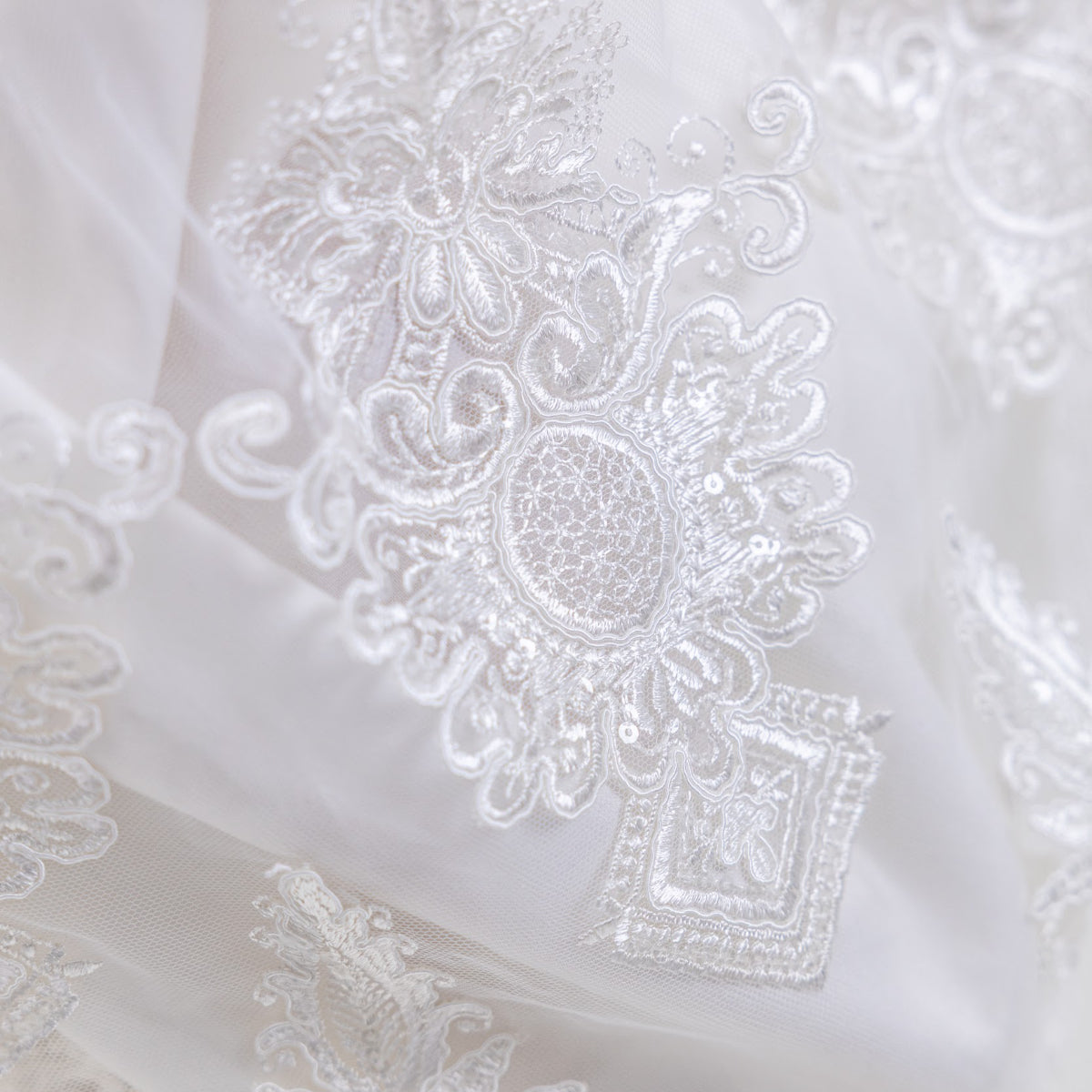 Close-up of Long Lace Christening Gown for Girls with intricate patterns