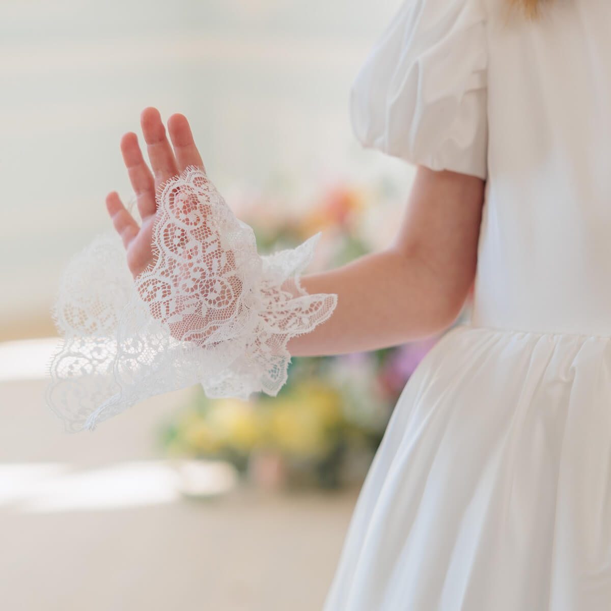 White lace glove on a blurred background