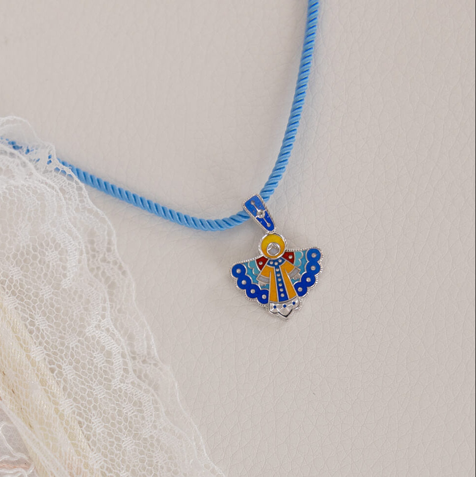 Necklace with a colorful pendant on a textured surface