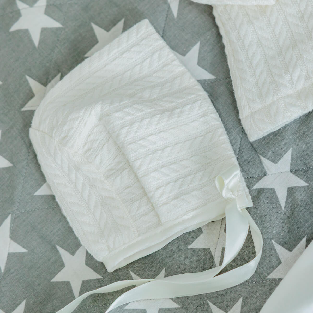 Boy Baptism Hat on a gray background with white star patterns