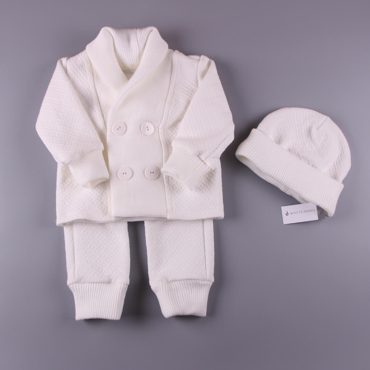 Baptism Outfit for Boys pants, and hat on a gray background