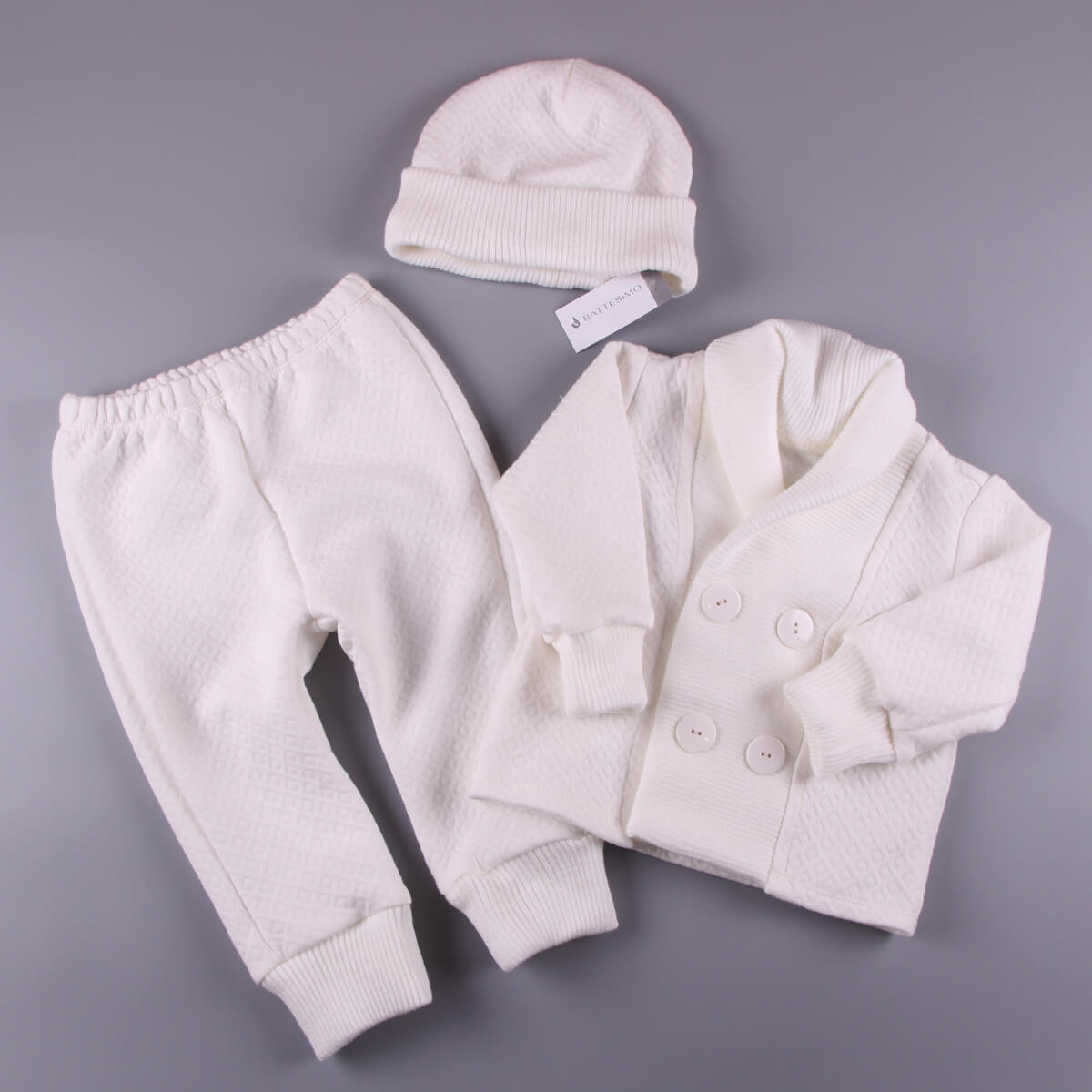 Baptism Outfit for Boys, pants, and hat on a gray background