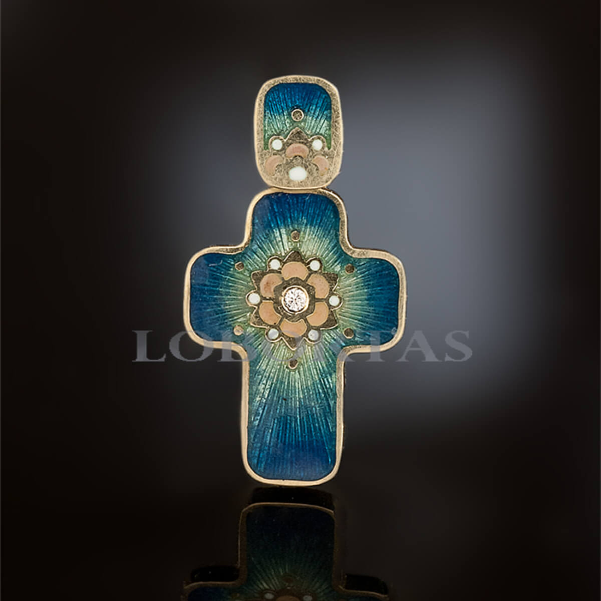 Baby baptism cross pendant with blue enamel and gold accents on a dark background