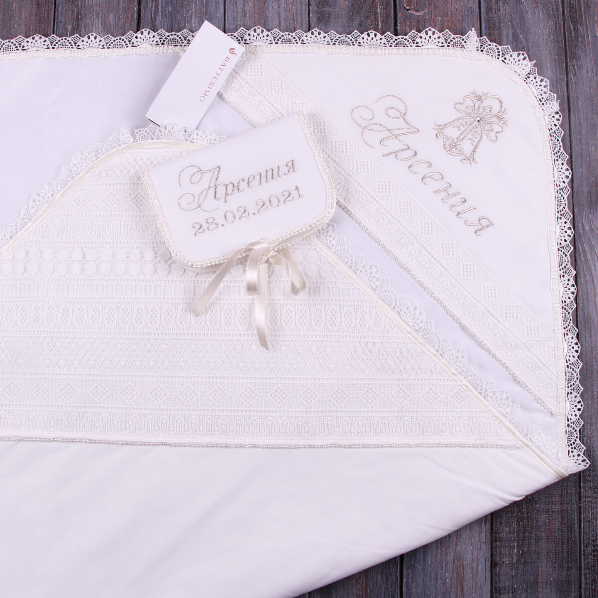 Lace Baptism Keepsake Box for First Curl with lace trim and embroidered name on a wooden surface