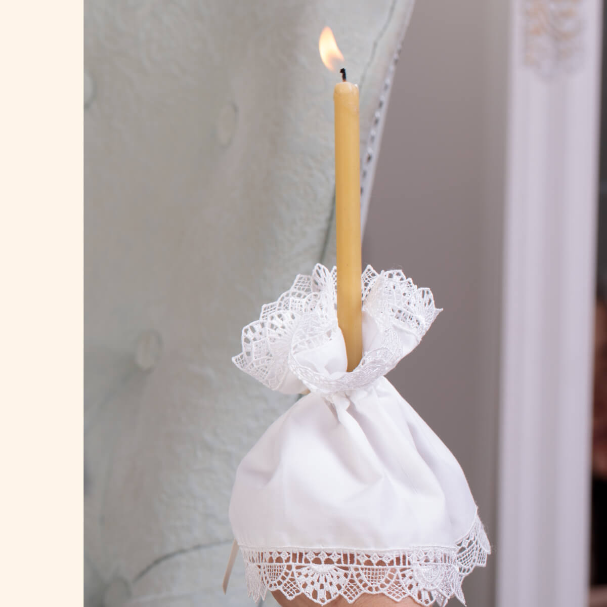 Candle in a Candle Wraps for Godparents with lace detailing against a neutral background
