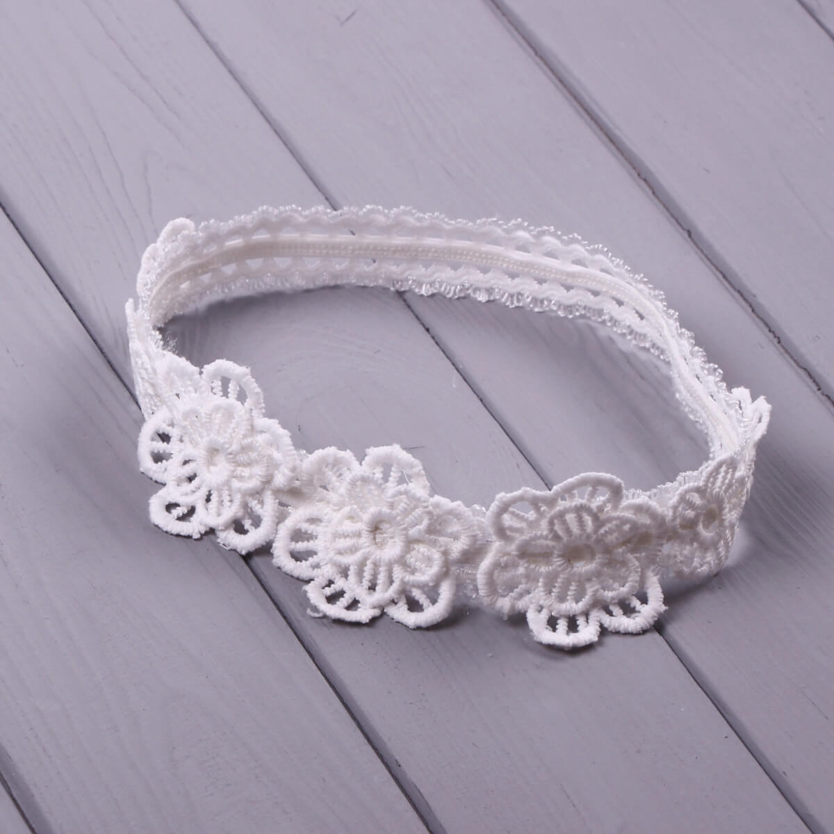 Baby headband on a wooden surface