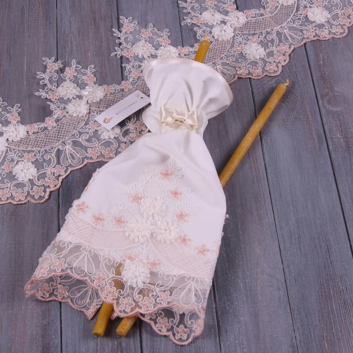 Lace Fabric Candle Wraps with wooden sticks on a wooden surface