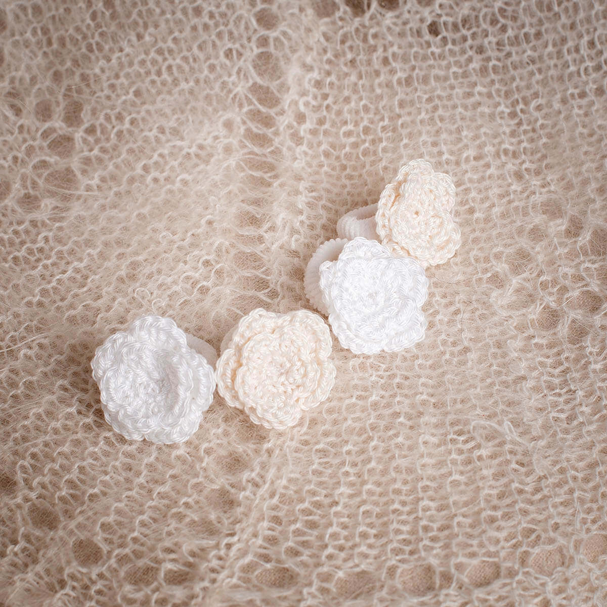 Baby Headbands on a textured beige fabric background