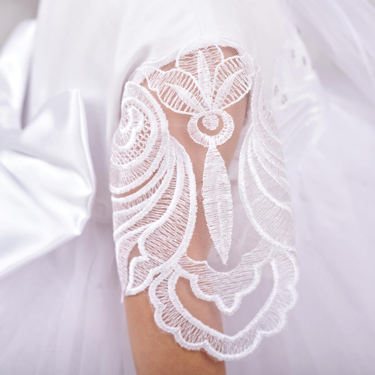 White lace sleeve on aWhite Baptism Dress