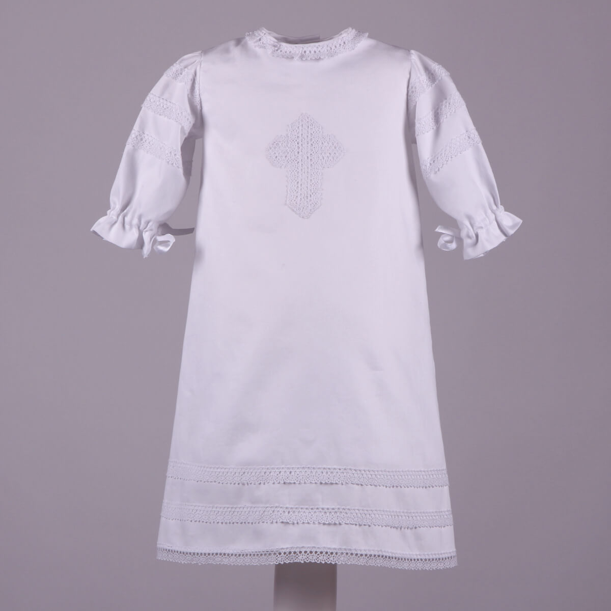 Baptism Gown with embroidery on a gray background