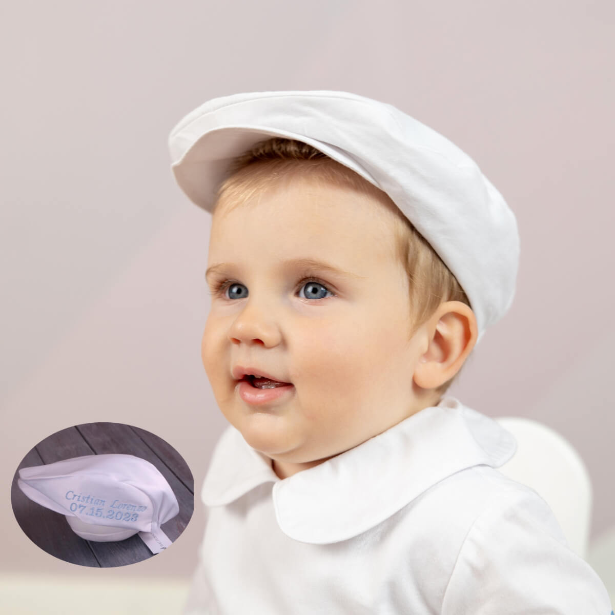 Baby wearing a Boy Christening Hat with a small inset showing the brand 'Cotons Laine'.