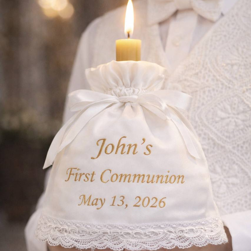 White drawstring bag with 'John's First Communion May 13, 2026' text held by a person in formal attire.