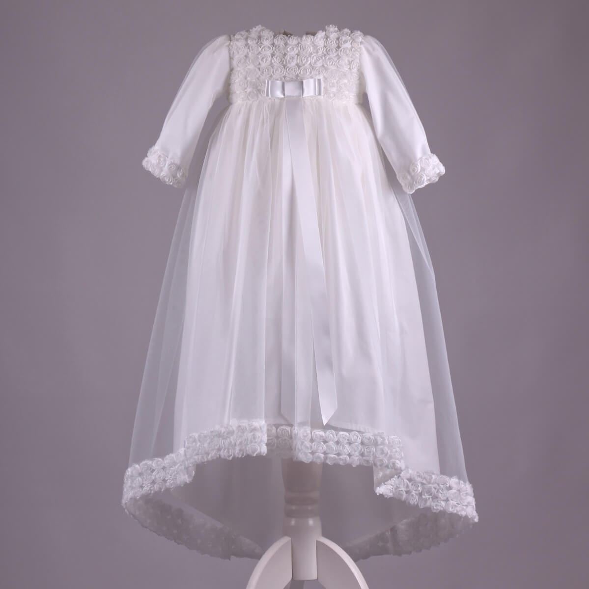 Girls Christening Gown on a gray background