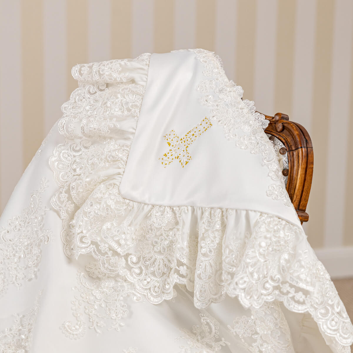 White christening blanket with a embroidered design