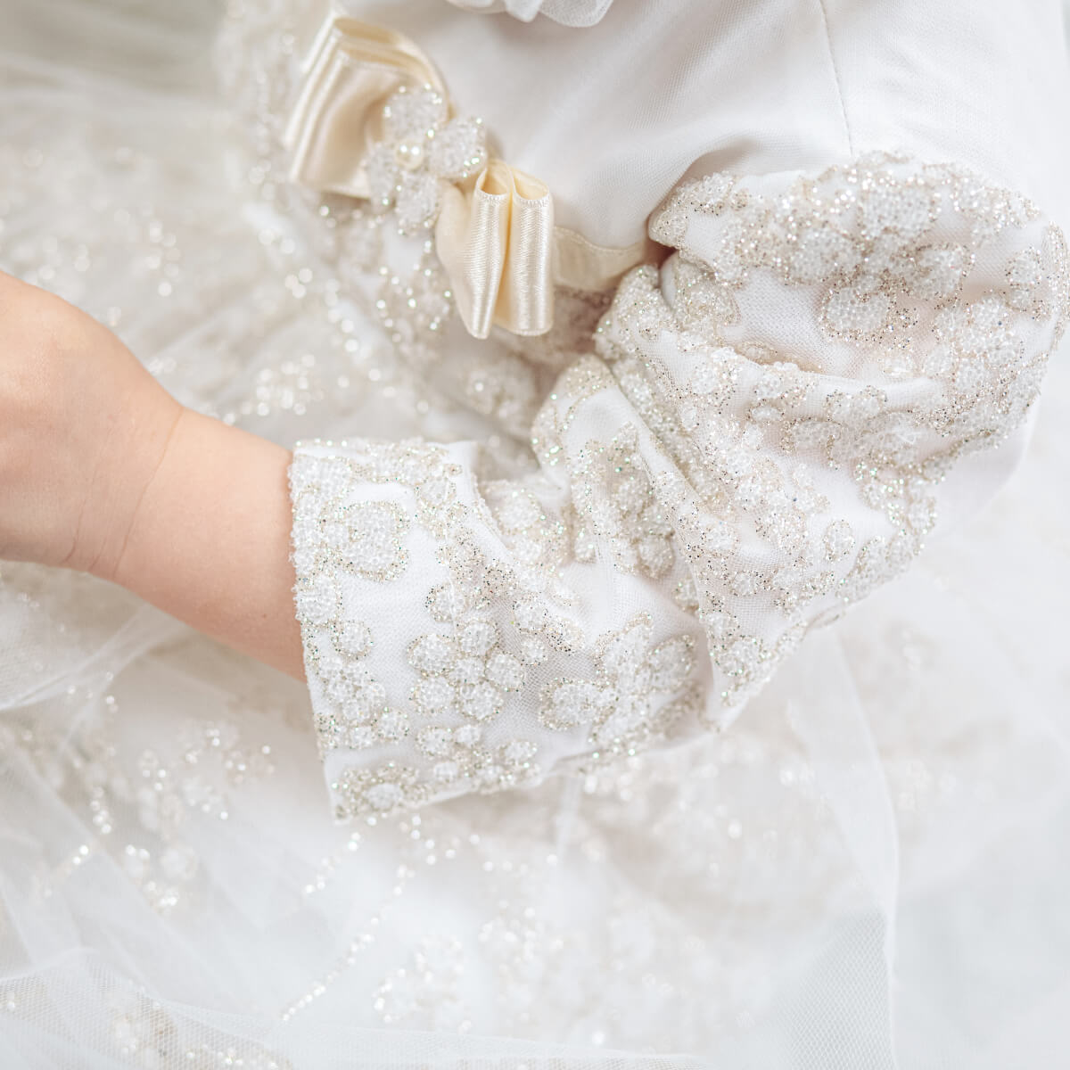 Close-up of a Christening Gown for Girls on a white background
