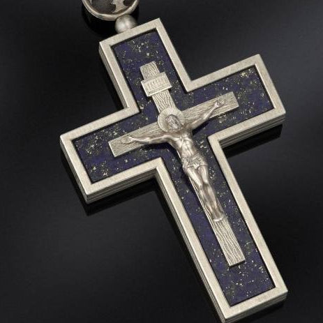 Collage of a blue beaded necklace with cross pendants on a dark background