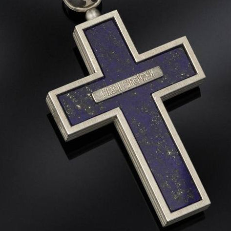Collage of a blue beaded necklace with cross pendants on a dark background