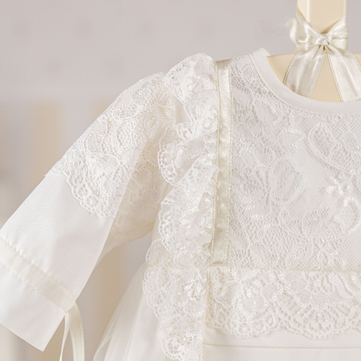 Heirloom Christening Gown. on a mannequin against a plain background