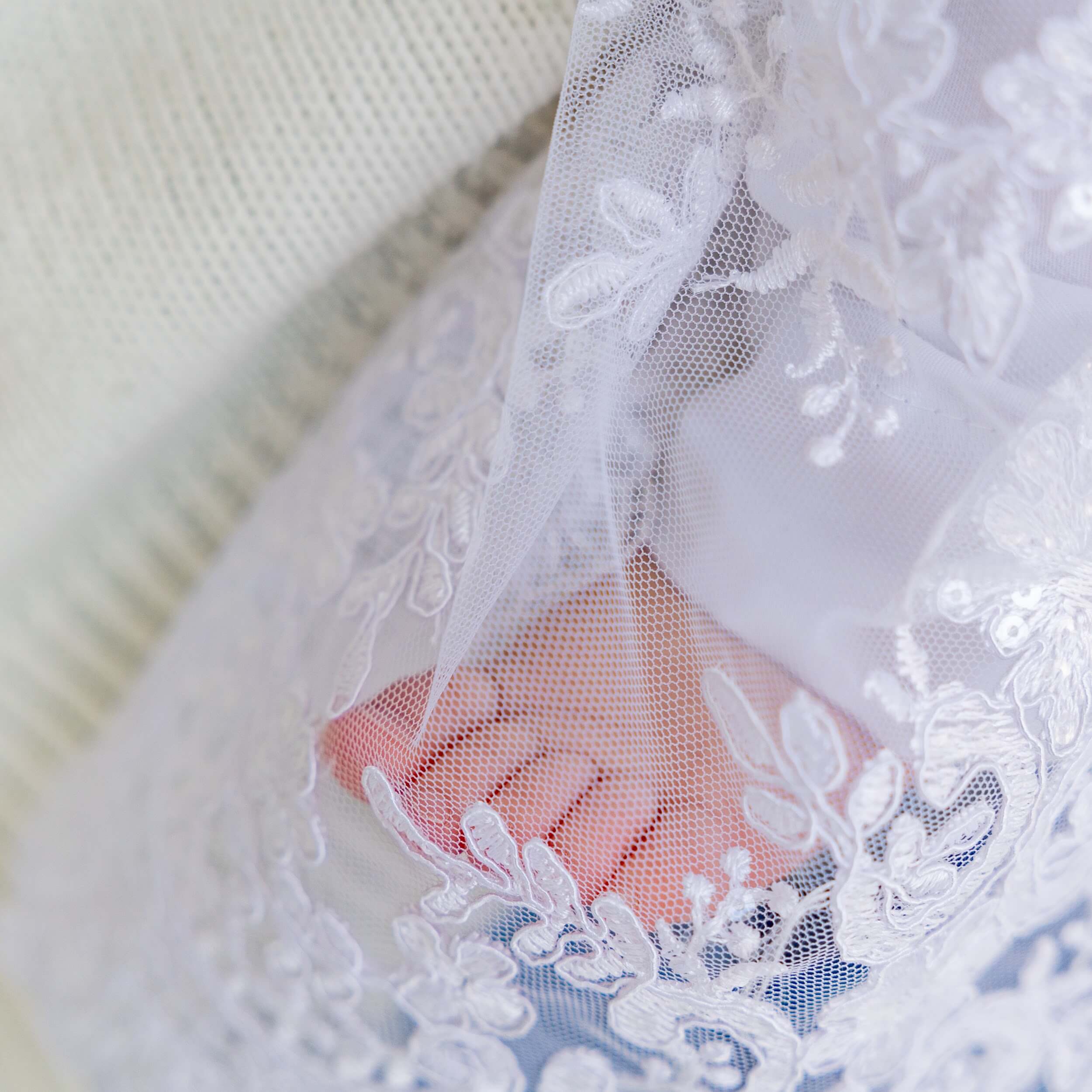 Close-up of a foot wearing a Christening Gown for Girls 