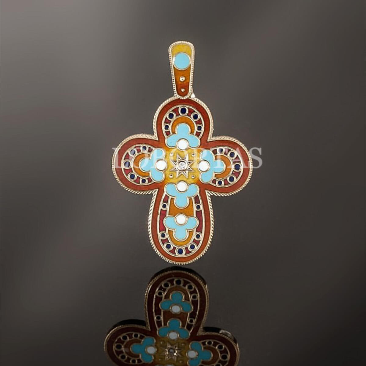 Baby Gold Cross FIVE ANGELS with turquoise stones on a reflective surface