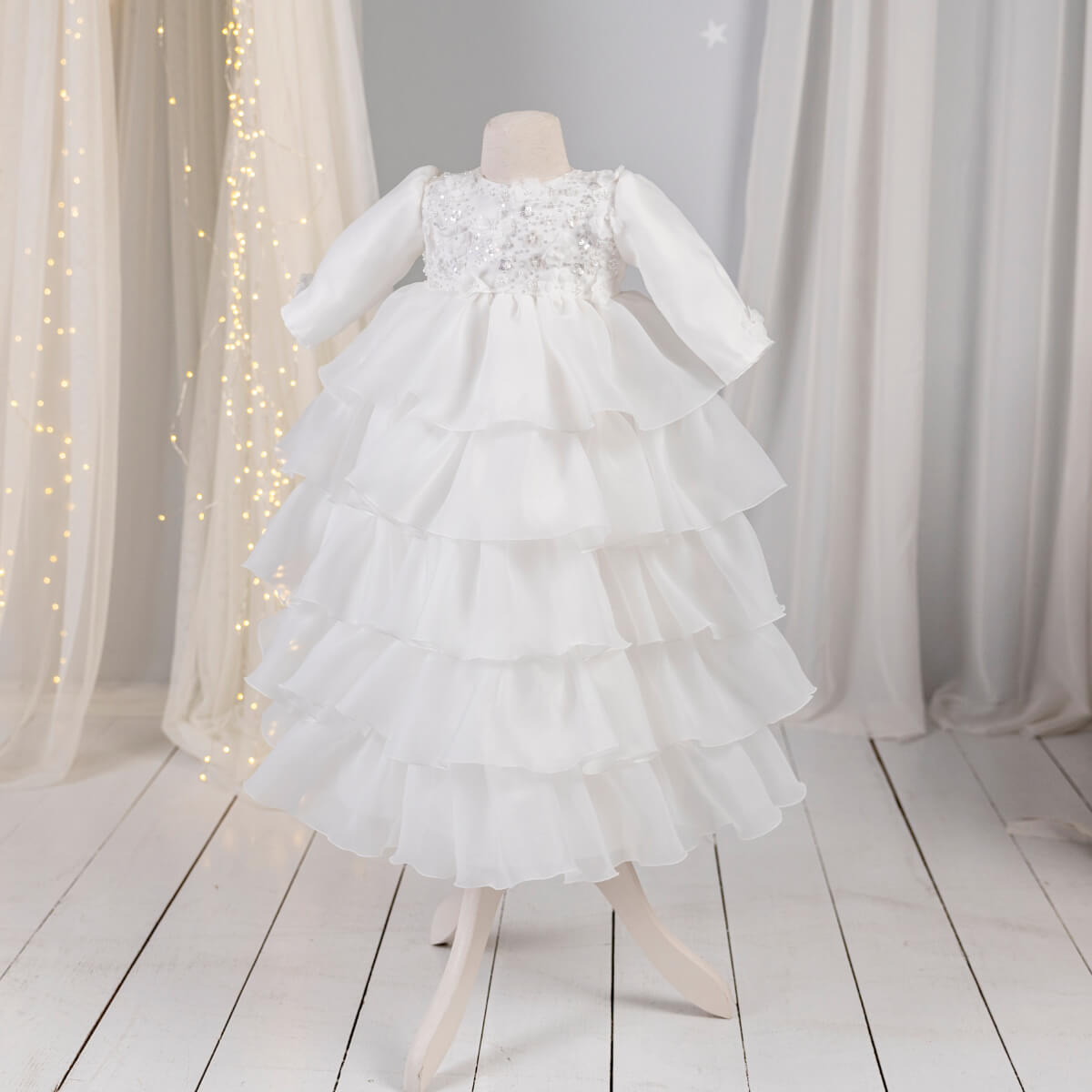 Christening Gown for Girls – on a mannequin against a white curtain background