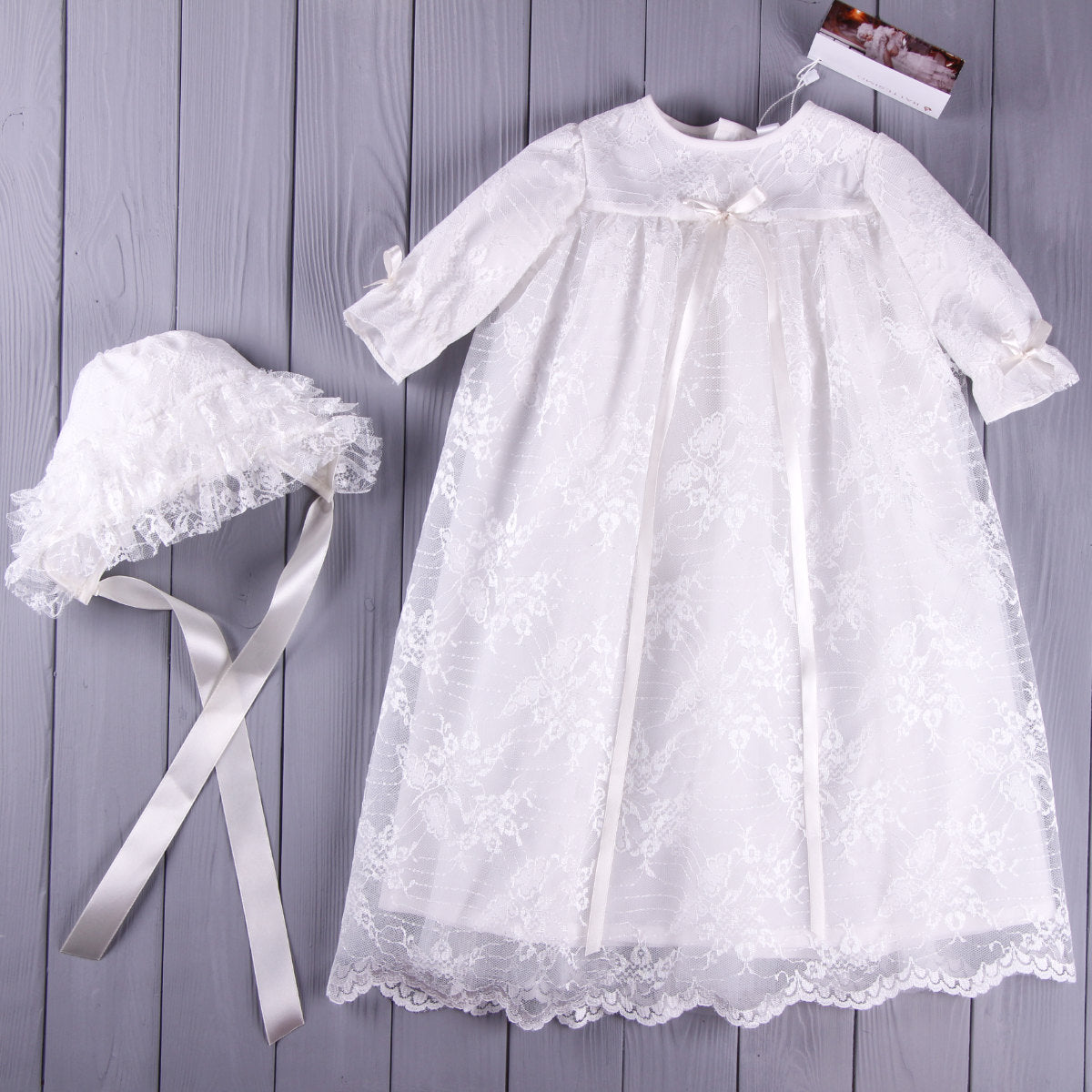 Lace Baptism Gown Set with Bonnet for Girl  with matching bonnet on a wooden surface