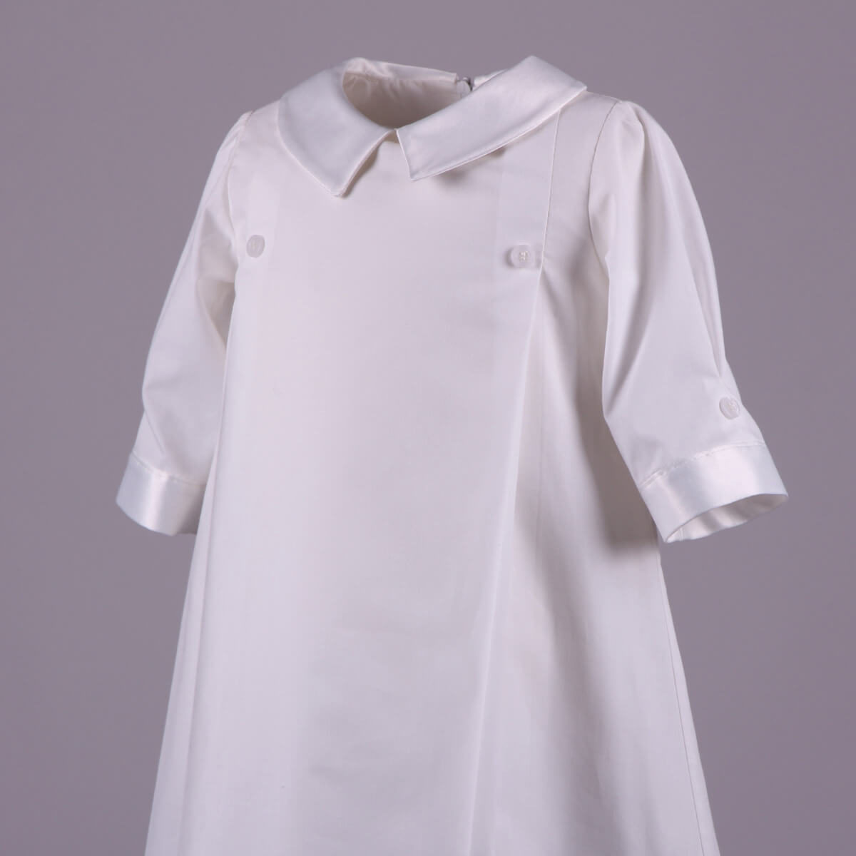 Baptism Gown with a Peter Pan collar on a gray background