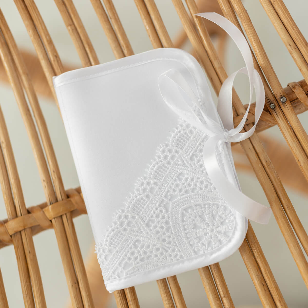 Baptism First Curl Keepsake Box with a ribbon on a wooden surface