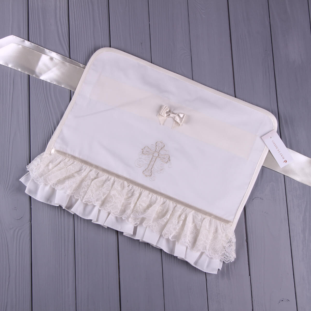 Candle Wraps with a cross design on a wooden surface