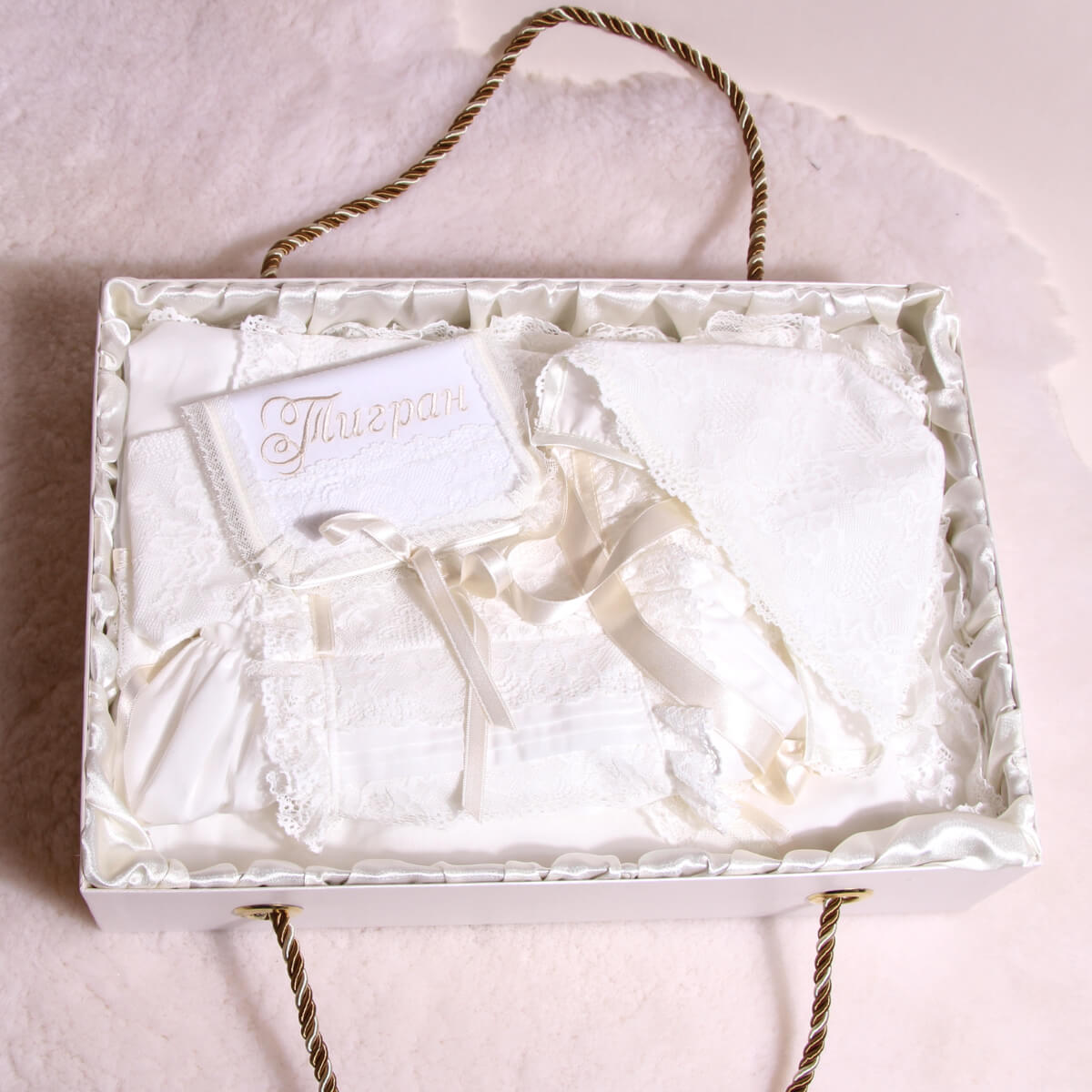 Baptism Keepsake Box with a name card in a decorative box on a marble surface