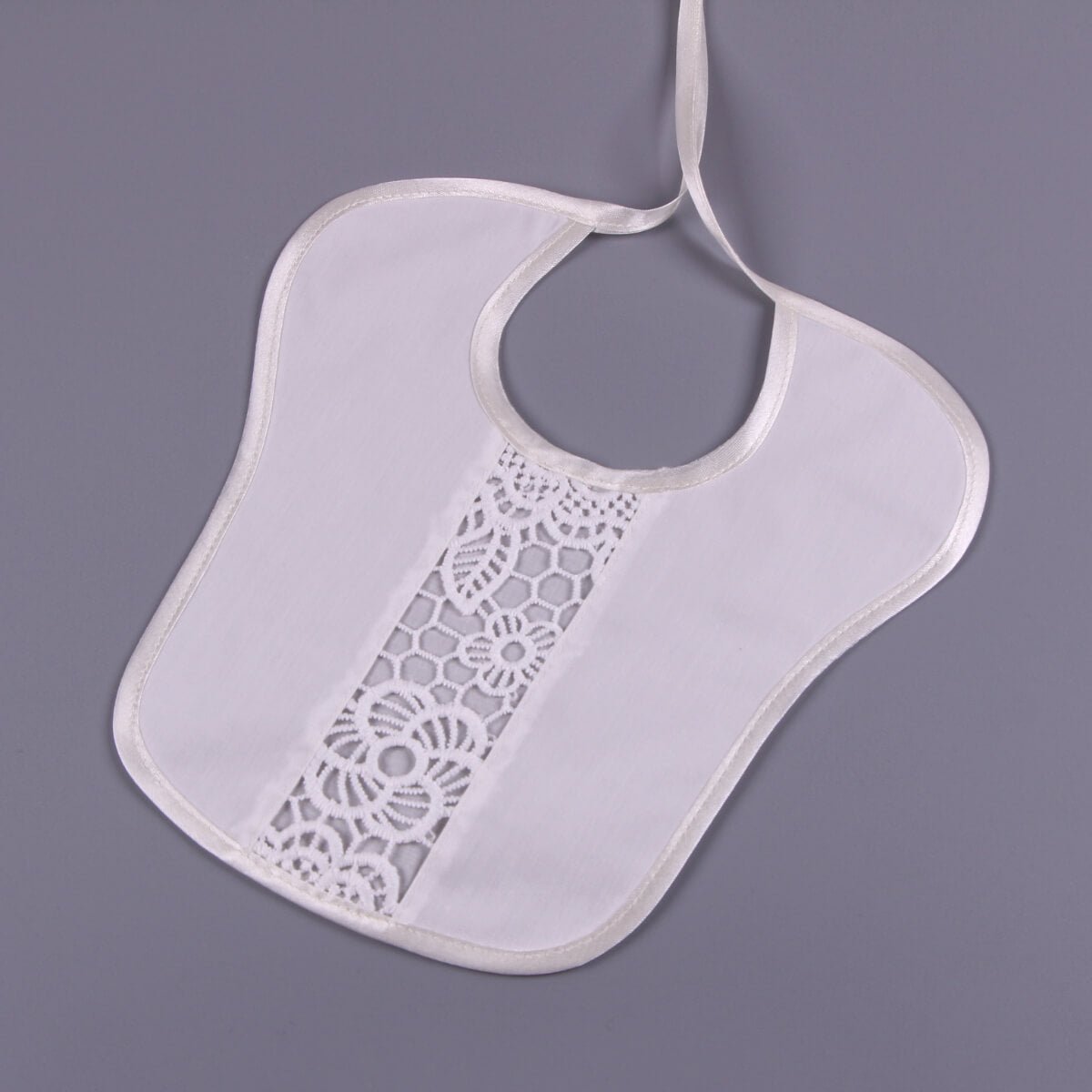 Newborn Lace Bib detailing on a gray background