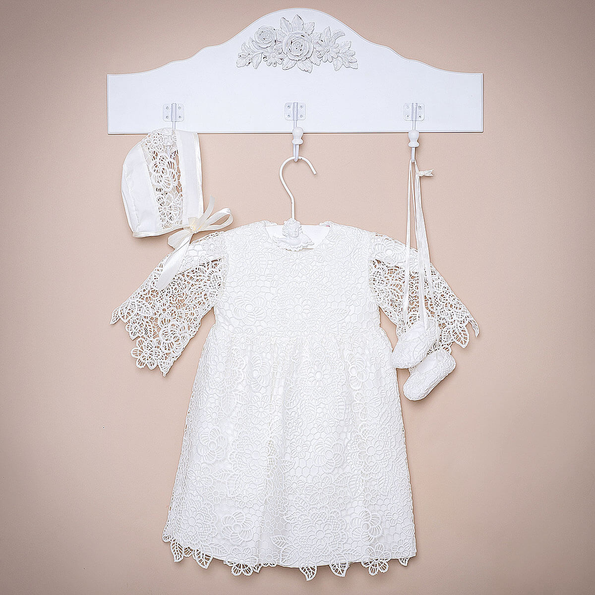 Baptism Dress Set for Girl  with bonnet and booties on a beige background