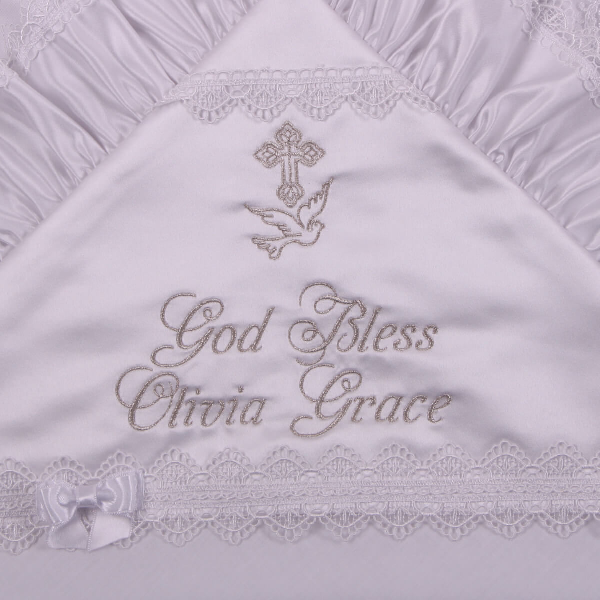 Embroidered blanket with 'God Bless Olivia Grace' text on a white background