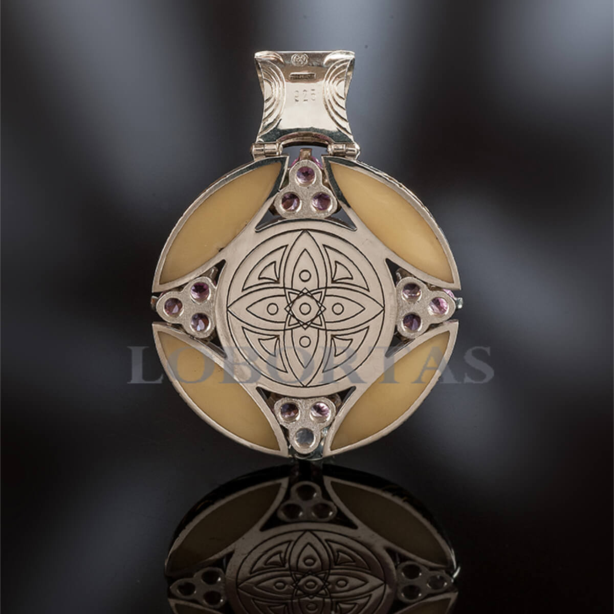 Decorative pendant with intricate design on a dark background