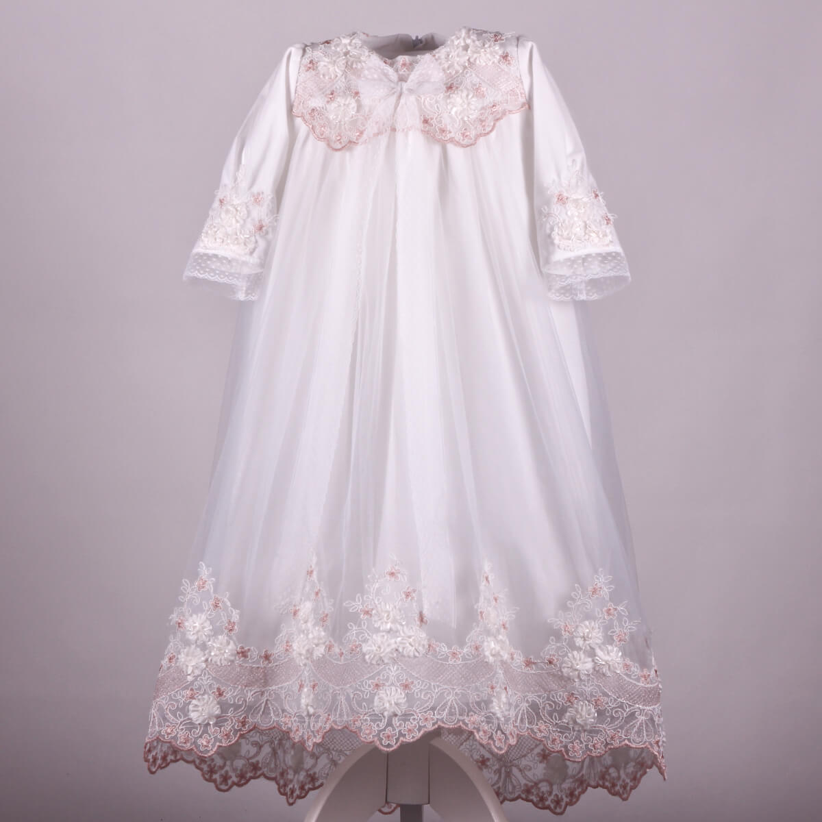 Long Christening Gown for Girls  with pink floral embroidery on a gray background