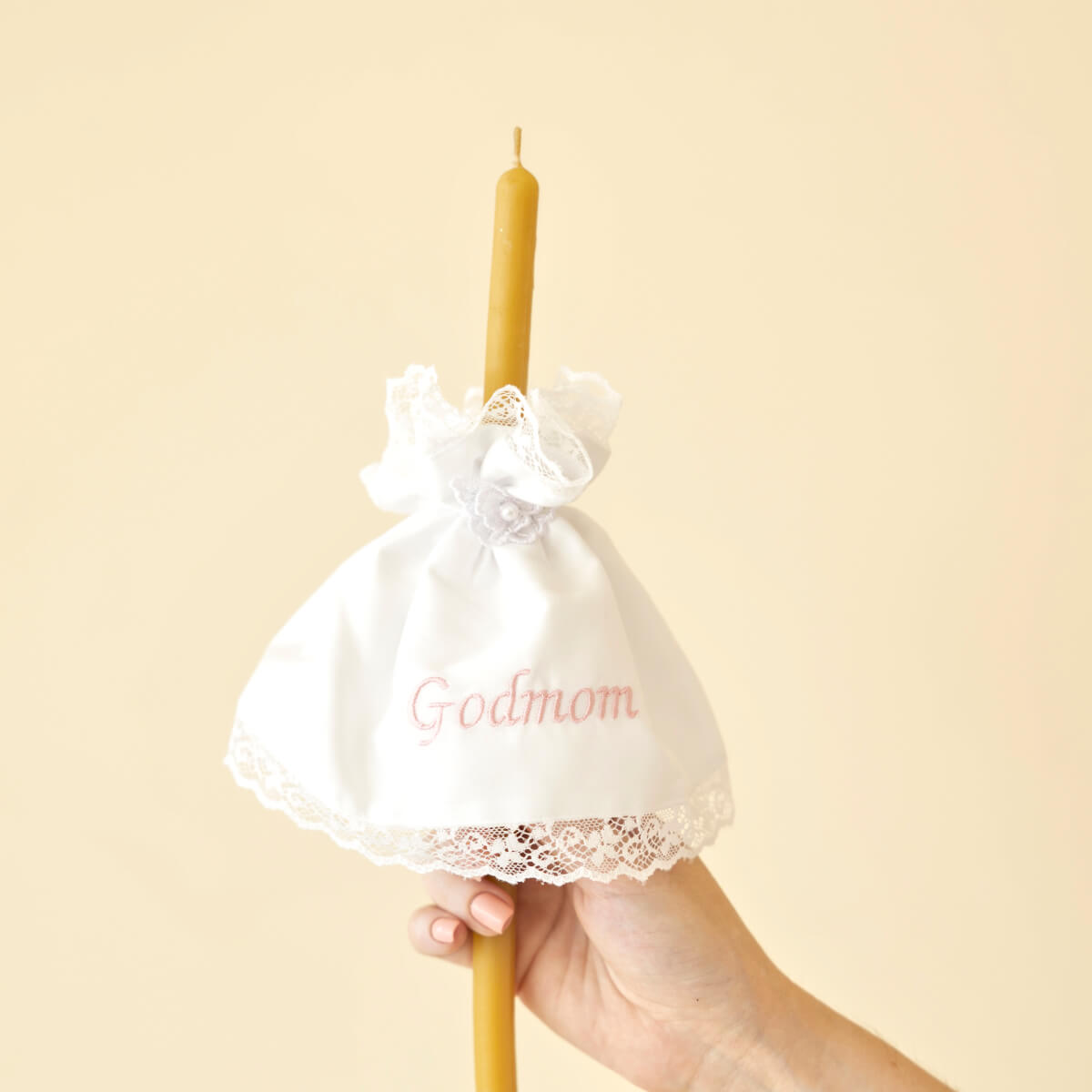 Candle in a Candle Wraps with 'Godmom' text on a beige background