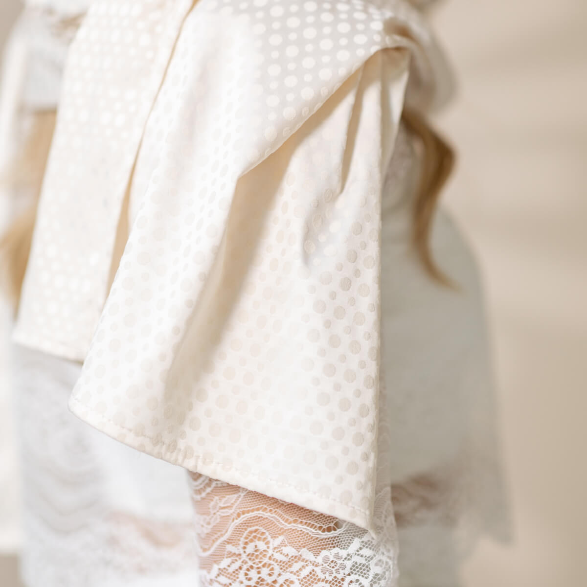 Silk Chapel Veil of a textured white fabric with lace trim