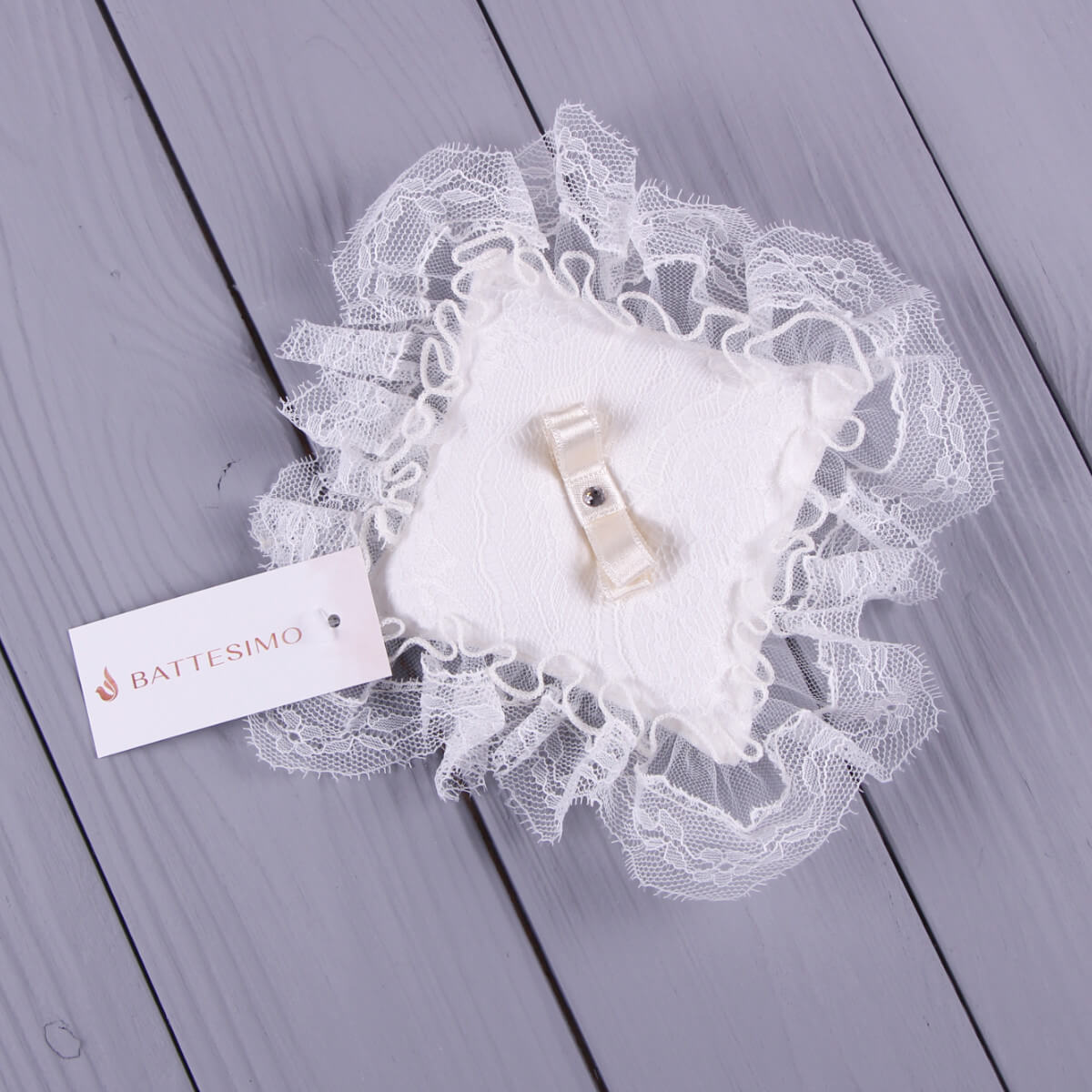 Baptism Ceremony Pillow with a clip on a gray wooden surface, featuring a Battesimo label.