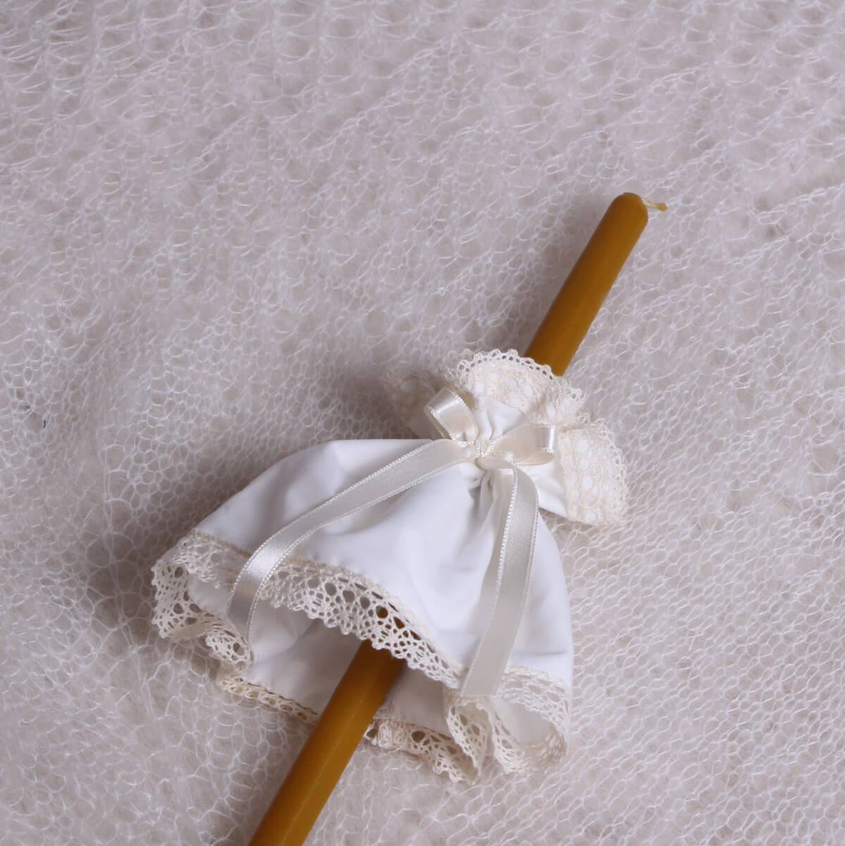  Fabric Candle Wraps  on a wooden stick against a textured gray background