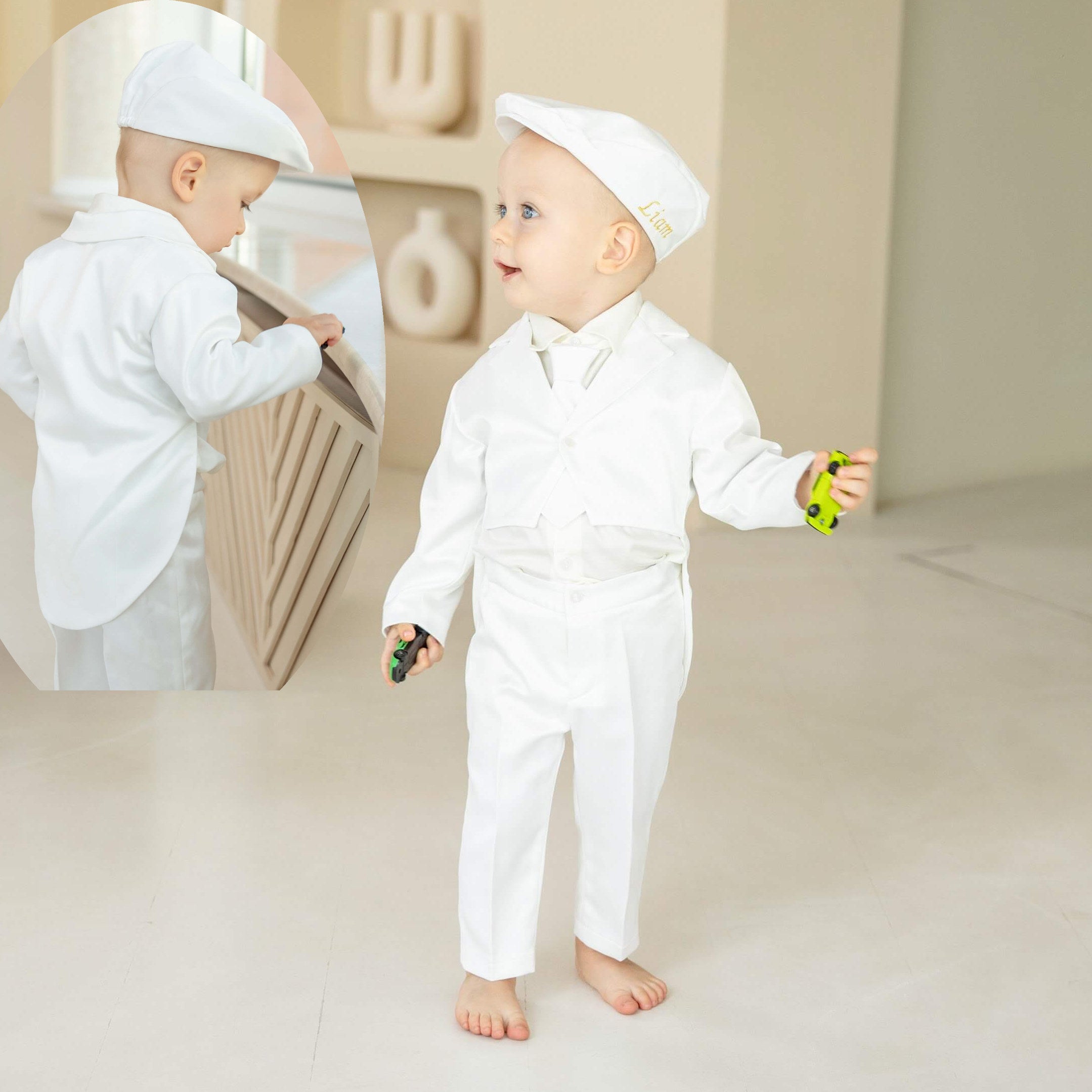 Child in a Baptism Suit for Baby Boys  standing in front of a mirror, reflecting on a neutral background