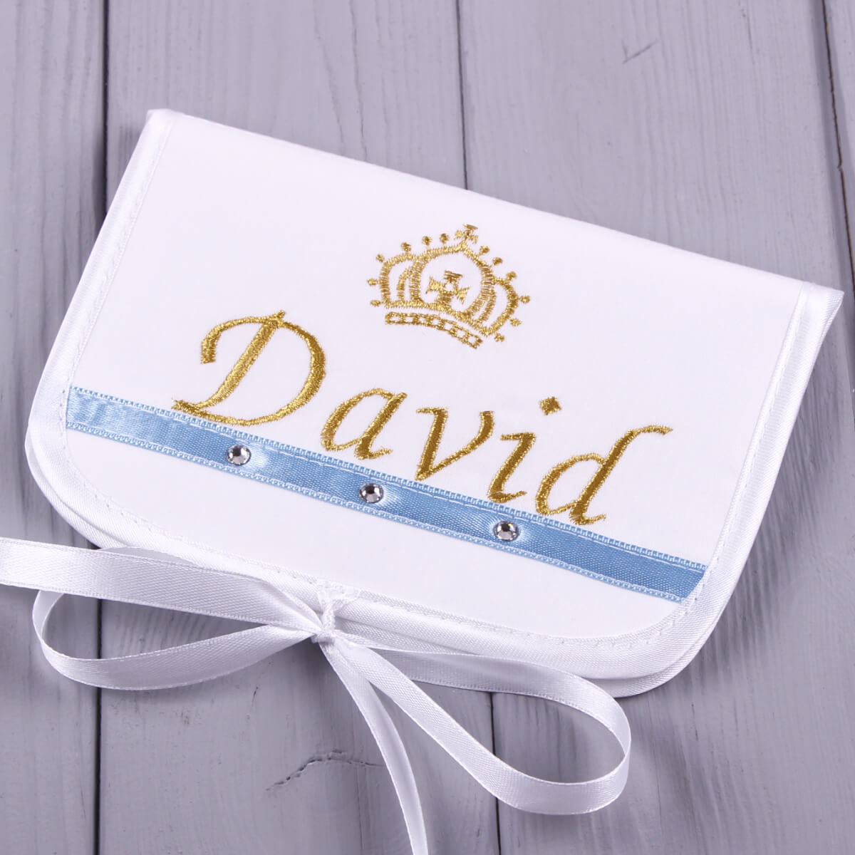 First Curl Keepsake Box with 'David' and a crown design on a wooden surface