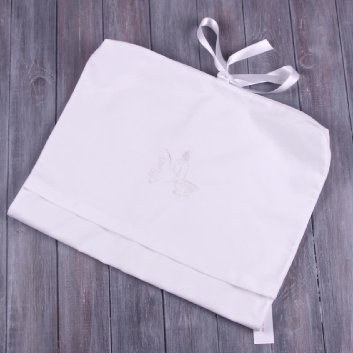 Baby Keepsake with thin straps on a wooden surface