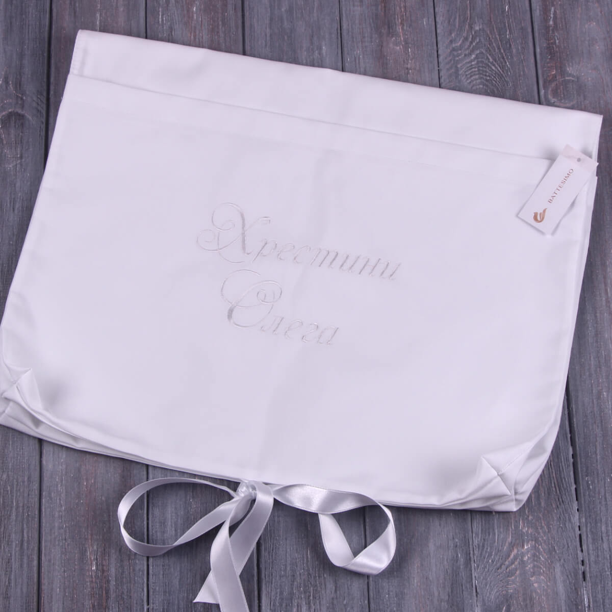 Baby Keepsake with 'La Perla' branding on a wooden surface