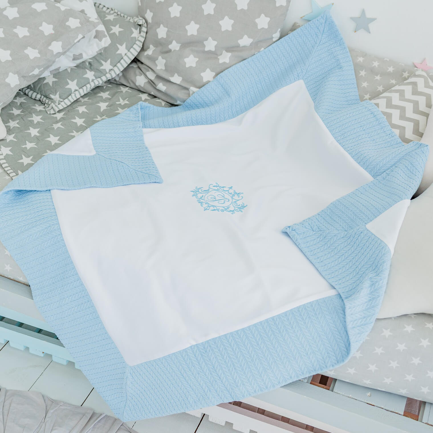 Coming Home Blanket  with blue and white pattern on a star-patterned surface