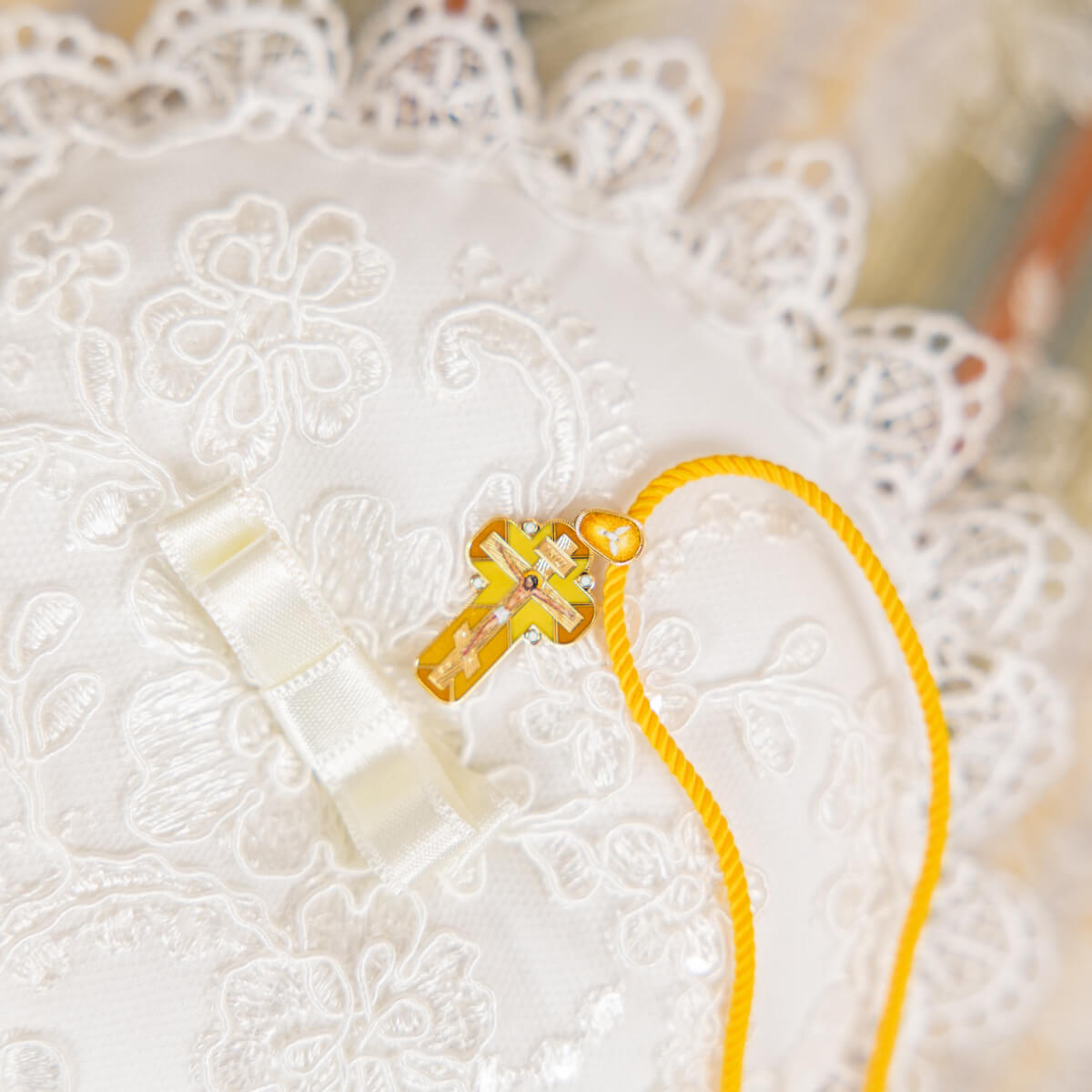 Ceremony Pillow with a clear cross on a white lace background