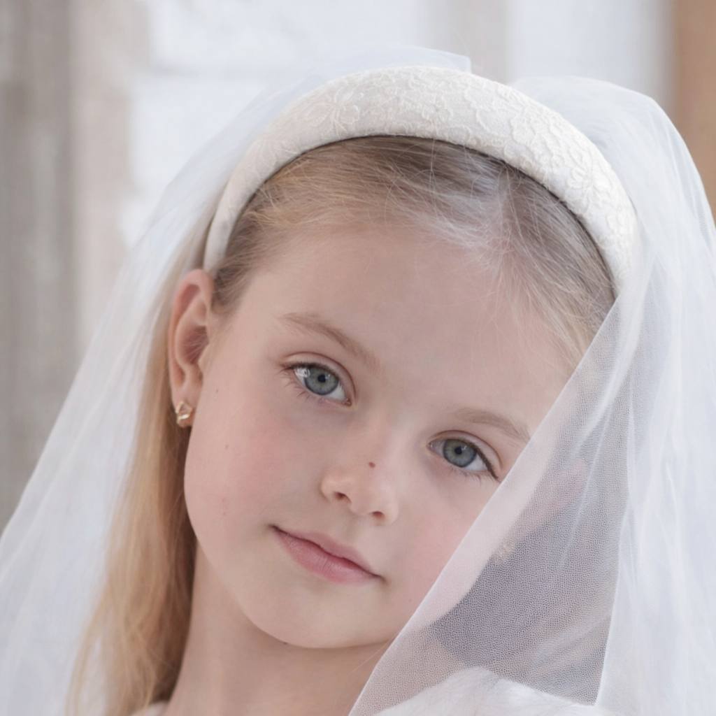 Young girl wearing a white headscarf with a blurred background