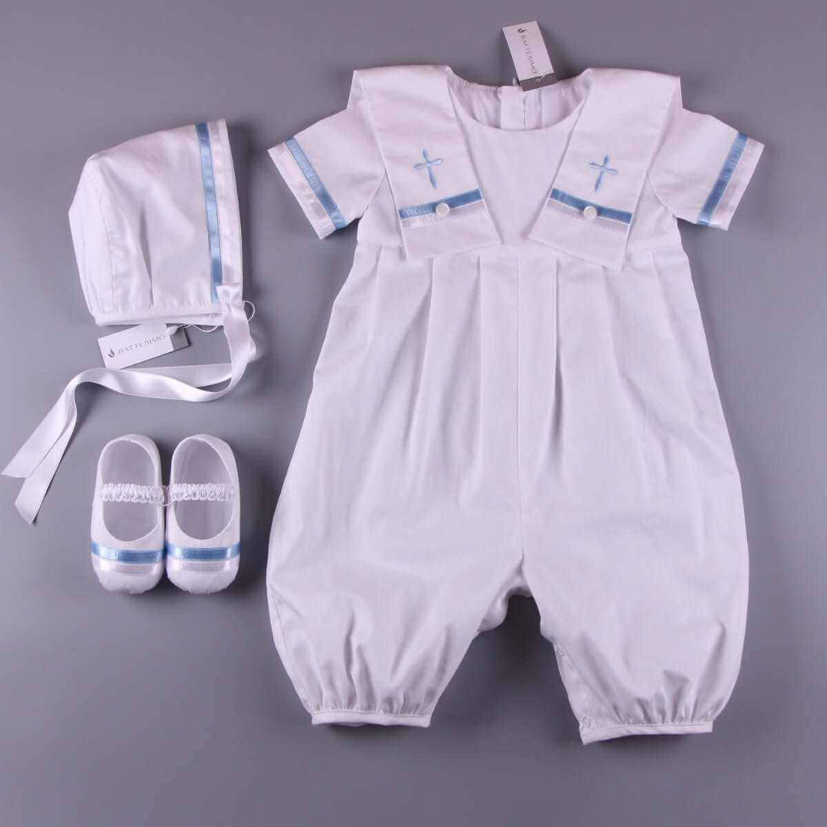 BBoy Baptism Outfit  with romper, shoes, and hat on a gray background